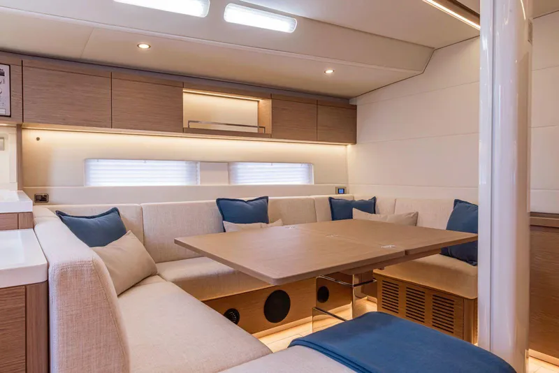 Slide: The Image of Luxurious interior of 2025 Grand Soleil 52 Performance yacht with elegant seating and table. - 33