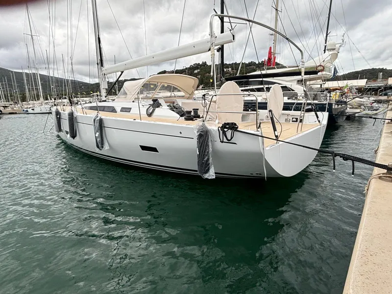 Slide: The Image of 2025 Grand Soleil 52 Performance yacht docked in marina, overcast sky. - 35