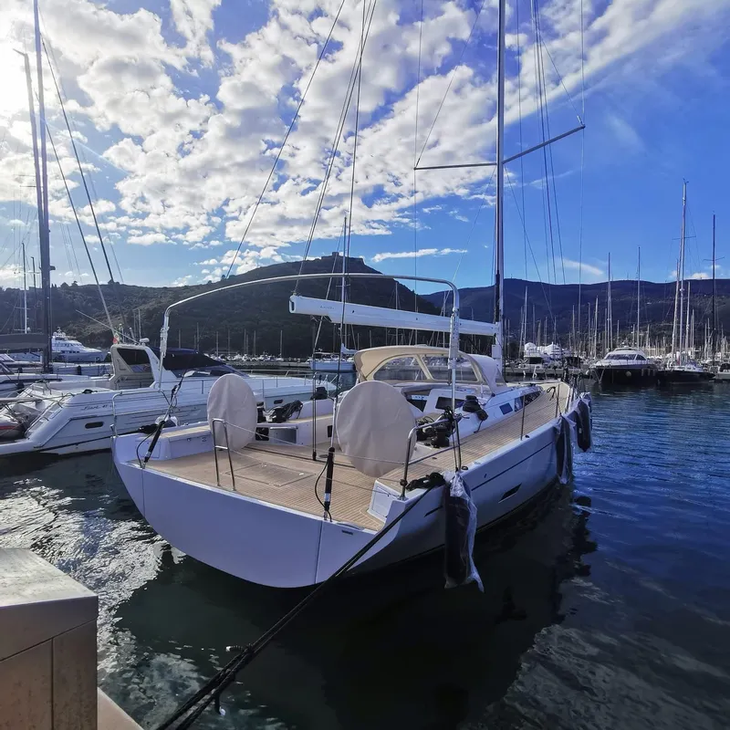 Slide: The Image of Grand Soleil 52 Performance yacht docked in marina, 2025 model, under blue sky. - 36