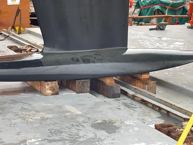 Slide: The Image of Grand Soleil 52 Performance 2025 yacht keel on wooden blocks in shipyard. - 41