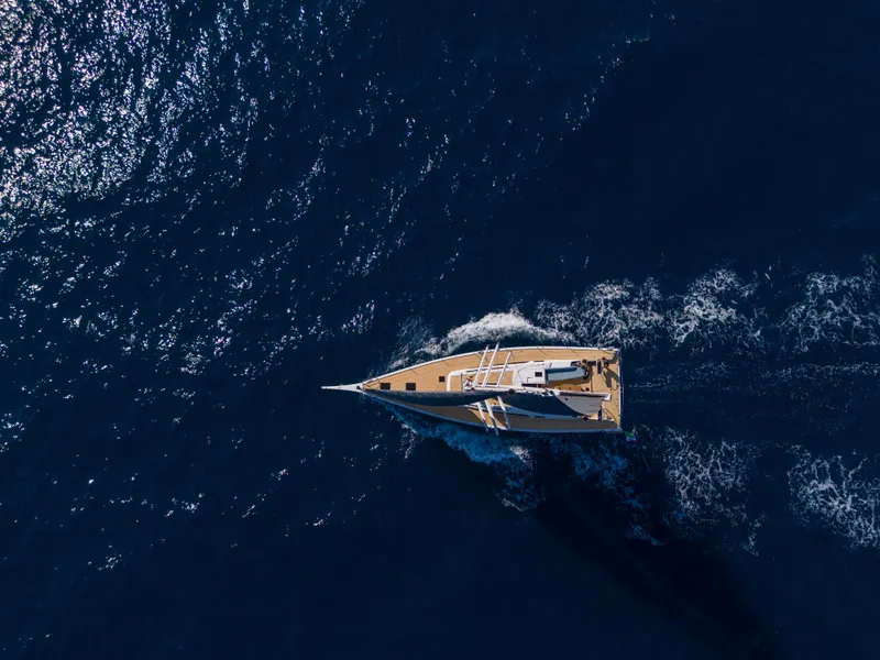 Slide: The Image of Aerial view of 2025 Grand Soleil 52 Performance yacht sailing on deep blue ocean. - 5