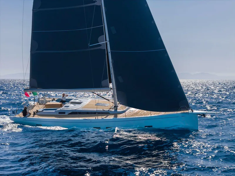 Slide: The Image of 2025 Grand Soleil 52 Performance yacht sailing on open sea. - 9