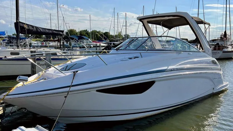 Slide: The Image of 2021 Regal 28 Express boat docked in marina, sunny day. - 3