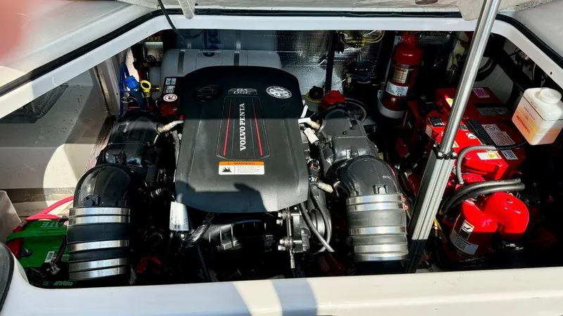 Slide: The Image of 2021 Regal 28 Express engine compartment with Volvo Penta engine and equipment. - 8