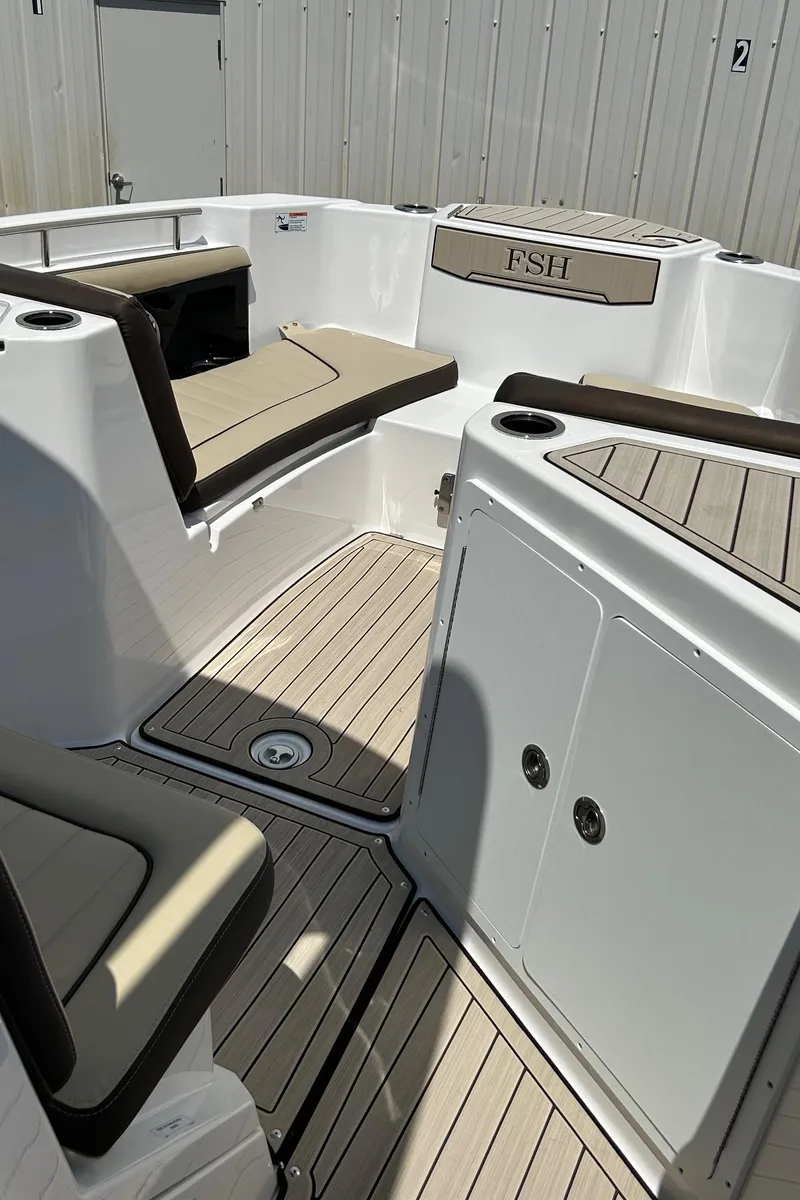 Slide: The Image of 2024 Yamaha Boats 252 FSH Sport interior with cushioned seating and sleek design. - 10