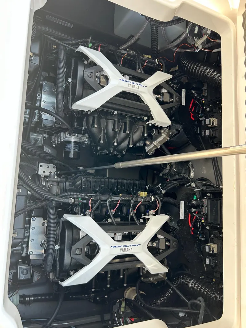Slide: The Image of 2024 Yamaha Boats 252 FSH Sport engine compartment with dual engines. - 5