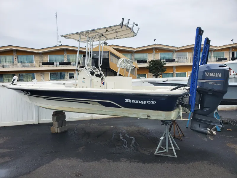 Slide: The Image of 2009 Ranger 2200 Bay Ranger boat with Yamaha outboard motor on display. - 1