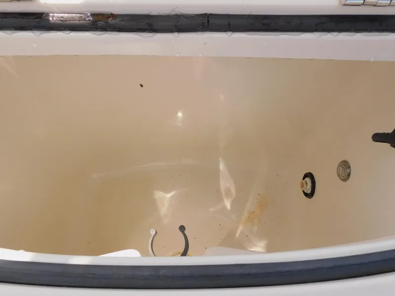 Slide: The Image of Livewell compartment of 2009 Ranger 2200 Bay Ranger boat, showing interior details. - 24