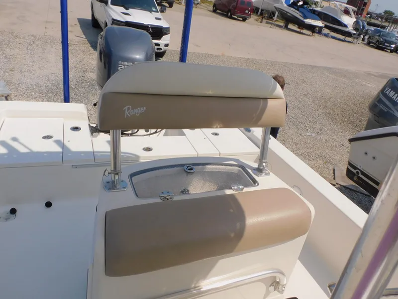 Slide: The Image of 2009 Ranger 2200 Bay Ranger boat with Yamaha engine, parked in a marina. - 26