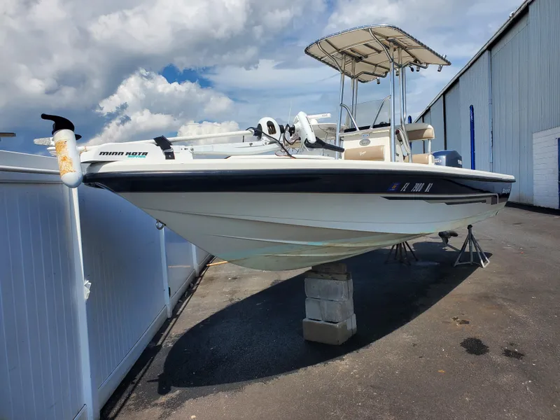 Slide: The Image of 2009 Ranger 2200 Bay Ranger boat on blocks, under a cloudy sky. - 7