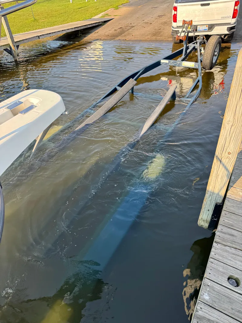 Slide: The Image of Boat trailer submerged in water, ready for Boston Whaler 26 Outrage, 2001 model. - 42