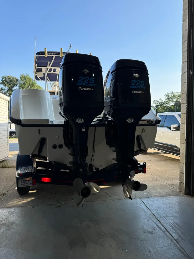 Slide: The Image of 2001 Boston Whaler 26 Outrage with twin Mercury 225 OptiMax engines in a garage. - 44