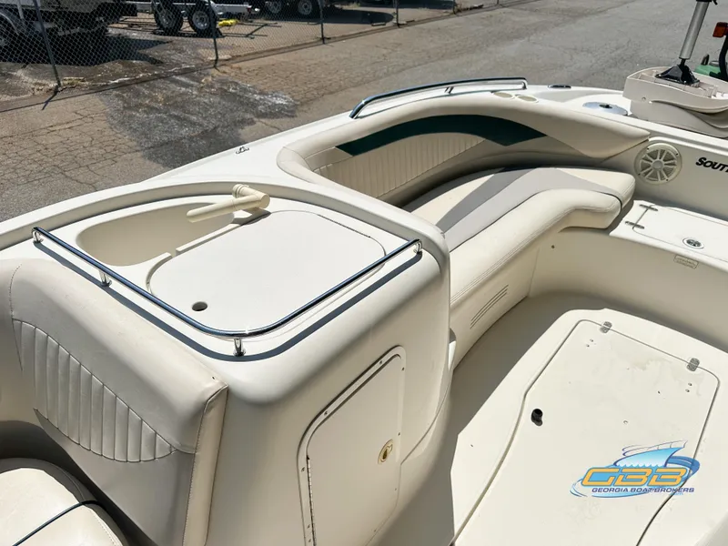Slide: The Image of 2007 SouthWind 210 SD boat interior with white seating and storage compartments. - 10