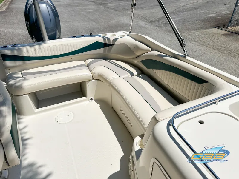 Slide: The Image of 2007 SouthWind 210 SD boat interior with white seating and teal accents. - 11