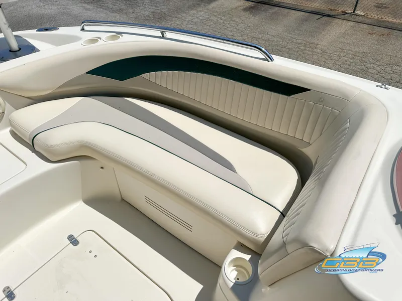 Slide: The Image of 2007 SouthWind 210 SD boat interior seating with cup holders and storage. - 19