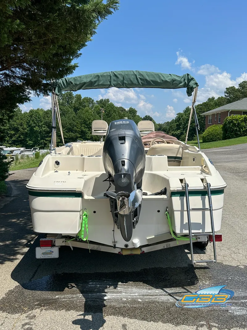 Slide: The Image of 2007 SouthWind 210 SD boat with outboard motor and green canopy. - 6