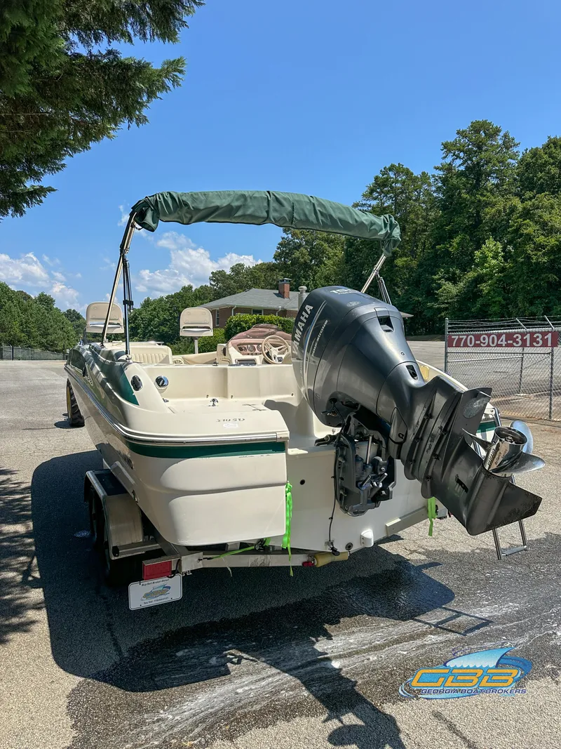 Slide: The Image of 2007 SouthWind 210 SD boat with outboard motor on trailer, parked outdoors. - 7