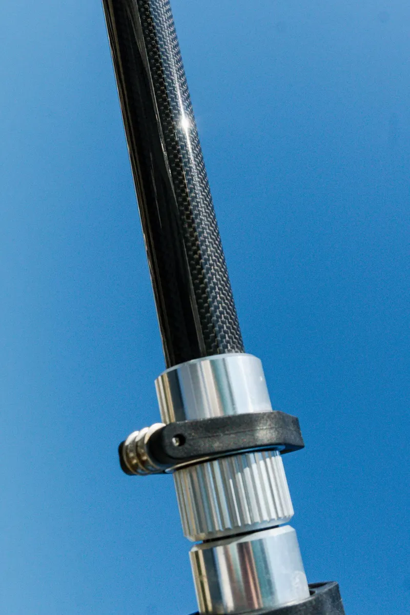Slide: The Image of Close-up of a fishing rod component against a clear blue sky. - 15