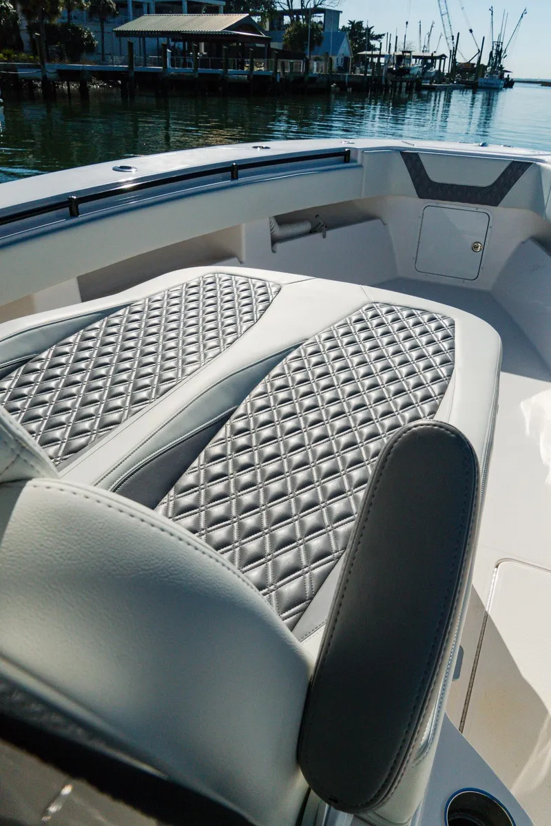 Slide: The Image of 2025 Invincible 36 Open Fisherman boat with luxurious diamond-stitched seating on deck. - 18