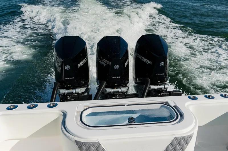 Slide: The Image of 2025 Invincible 36 Open Fisherman with triple Mercury engines cruising on water. - 24