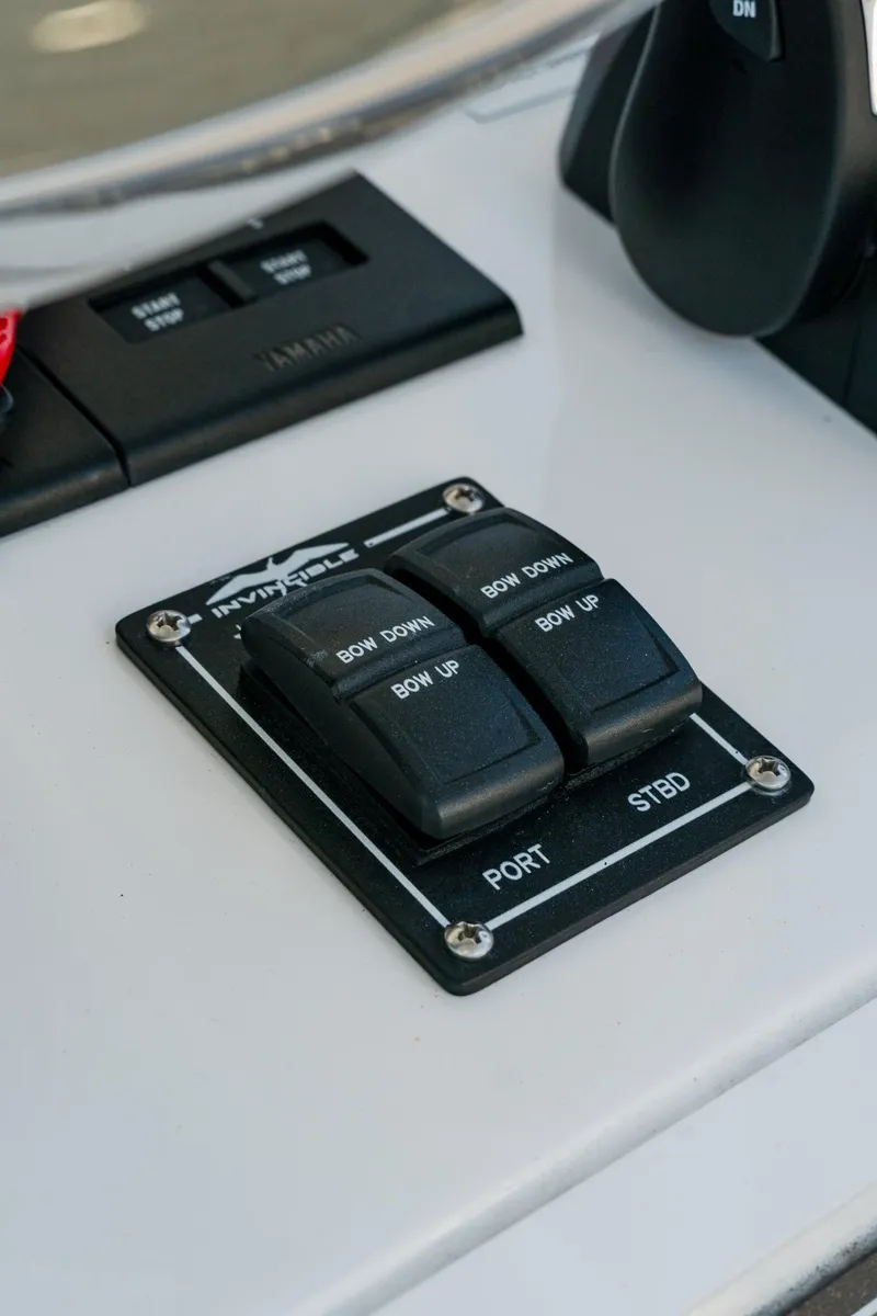 Slide: The Image of Control panel of 2025 Invincible 36 Open Fisherman boat, featuring port and starboard switches. - 25