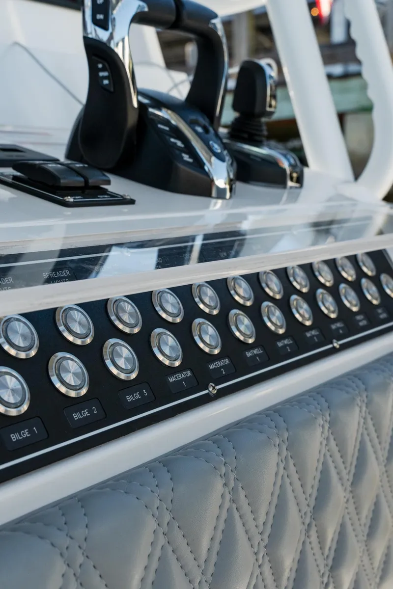 Slide: The Image of Control panel of 2025 Invincible 36 Open Fisherman boat with modern switches and controls. - 27