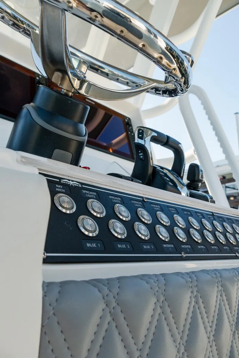 Slide: The Image of Control panel of 2025 Invincible 36 Open Fisherman boat with steering wheel. - 29