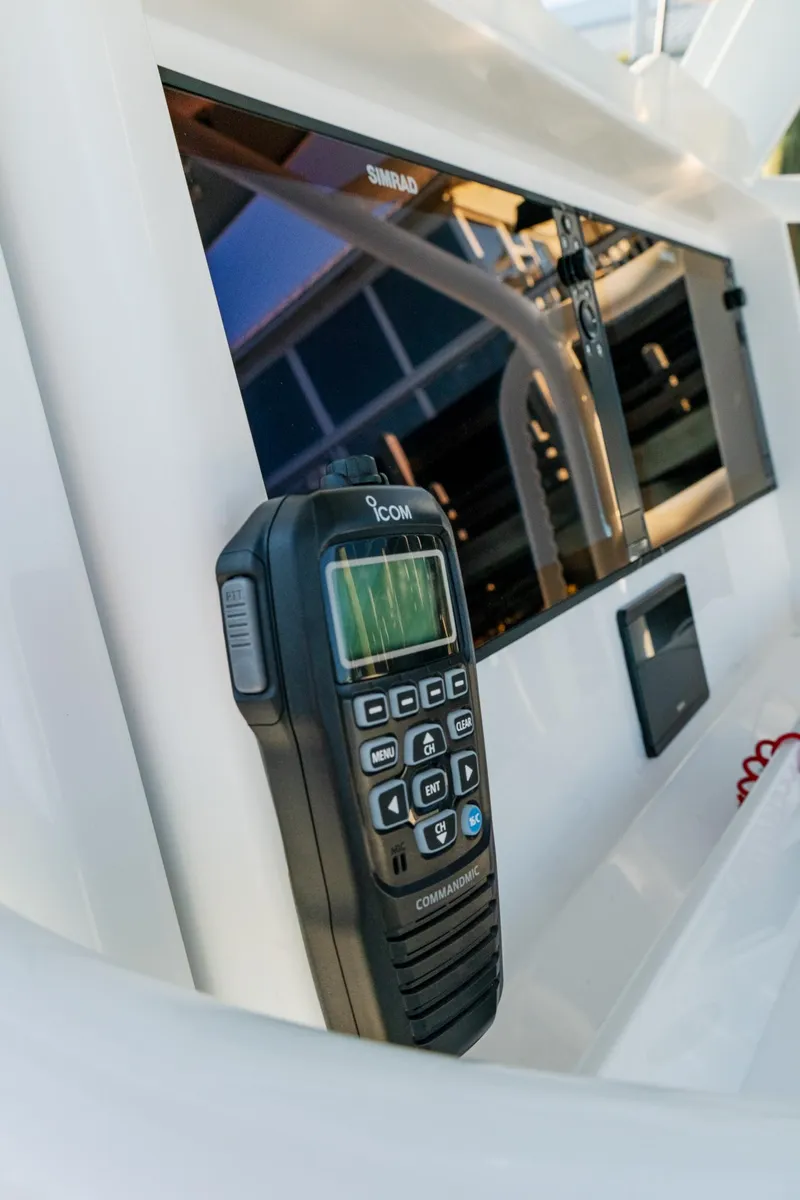 Slide: The Image of 2025 Invincible 36 Open Fisherman boat console with radio and display screen. - 30