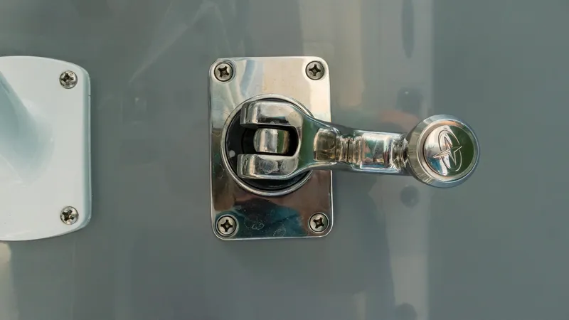 Slide: The Image of Chrome latch detail on 2025 Invincible 36 Open Fisherman boat. - 31