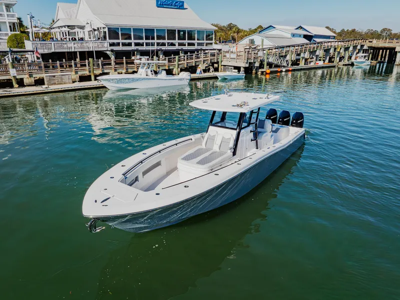 Slide: The Image of 2025 Invincible 36 Open Fisherman boat docked in a marina. - 40