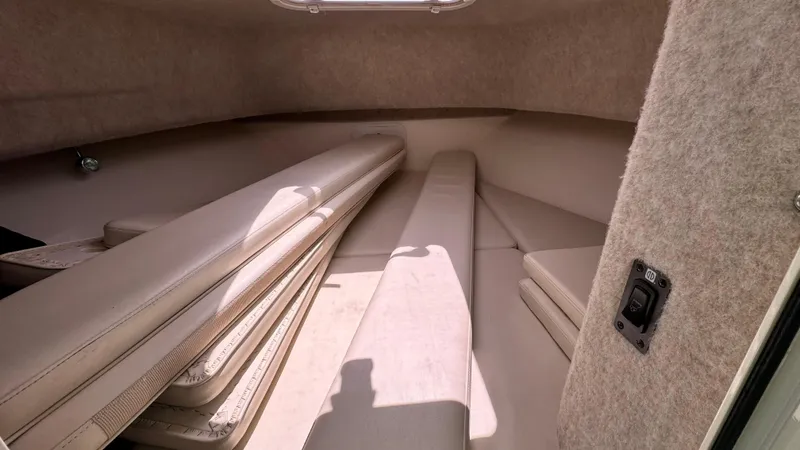 Slide: The Image of 2014 Defiance Guadalupe 290 EX cabin interior with beige upholstery and compact layout. - 17