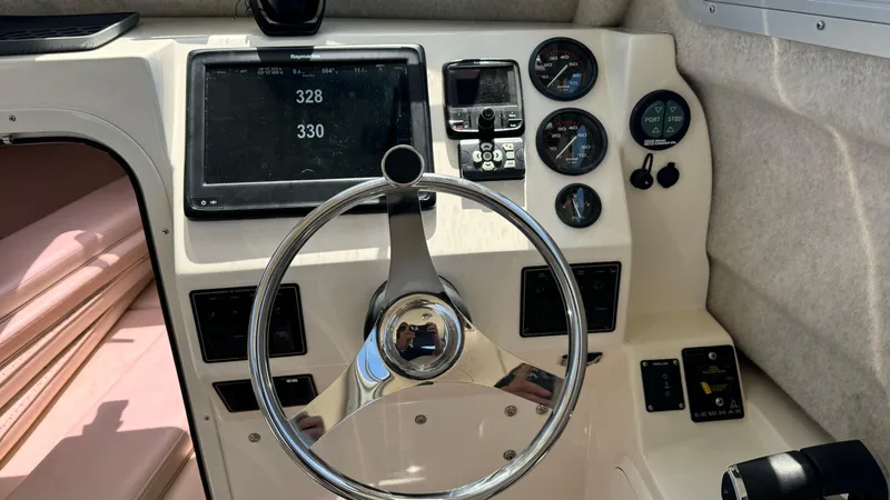 Slide: The Image of Steering console of 2014 Defiance Guadalupe 290 EX boat with gauges and navigation display. - 5