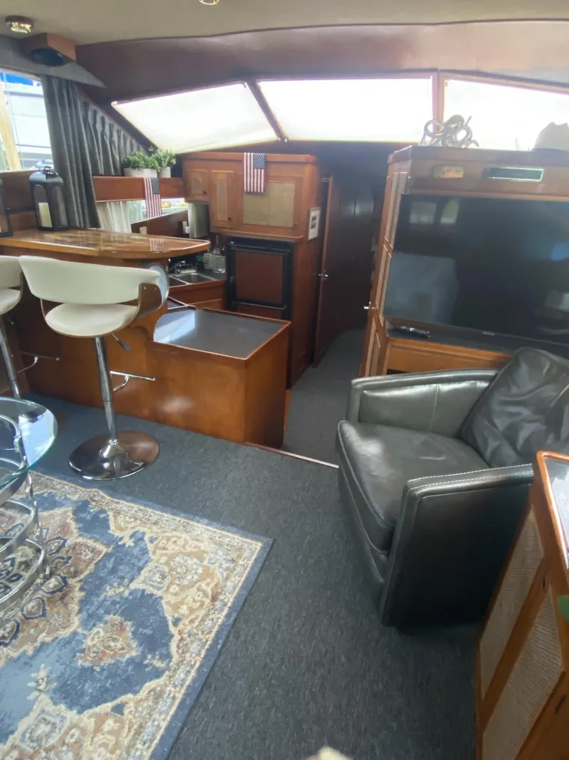 Slide: The Image of Interior of 1986 Midnight Lace 52 Flybridge yacht with modern seating and decor. - 10