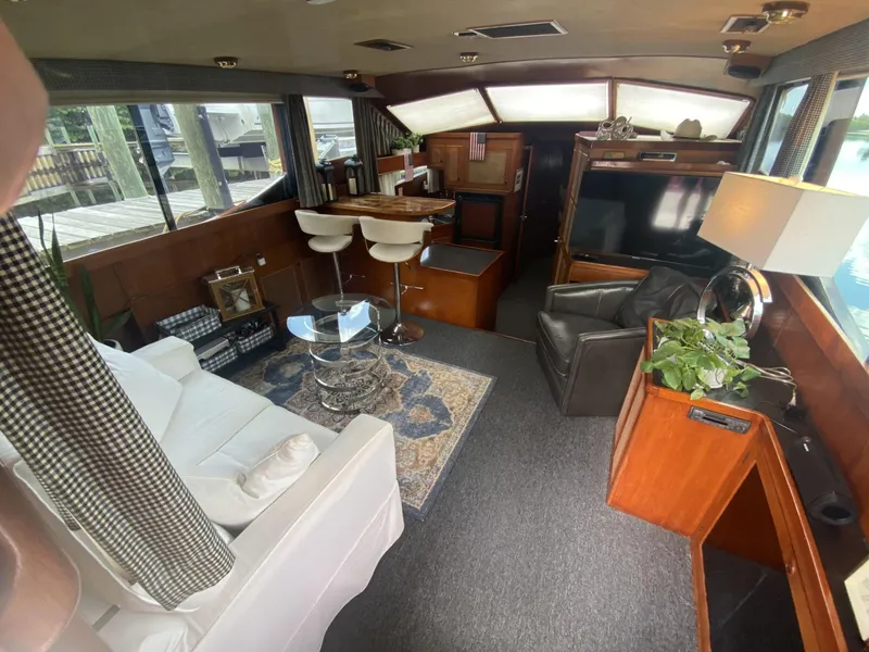 Slide: The Image of Interior of 1986 Midnight Lace 52 Flybridge yacht with modern furnishings and decor. - 12