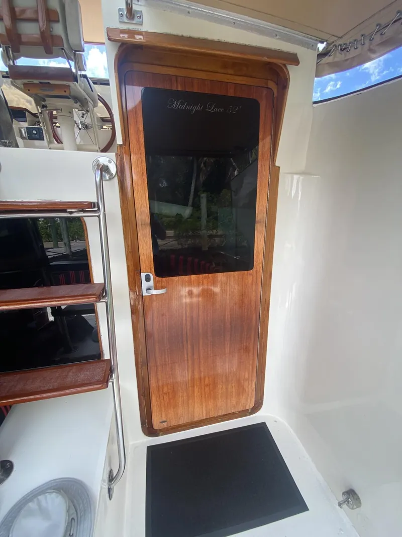 Slide: The Image of Wooden door on 1986 Midnight Lace 52 Flybridge yacht, featuring elegant design and craftsmanship. - 14