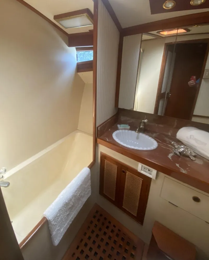 Slide: The Image of Bathroom interior of 1986 Midnight Lace 52 Flybridge yacht, featuring sink and shower. - 18