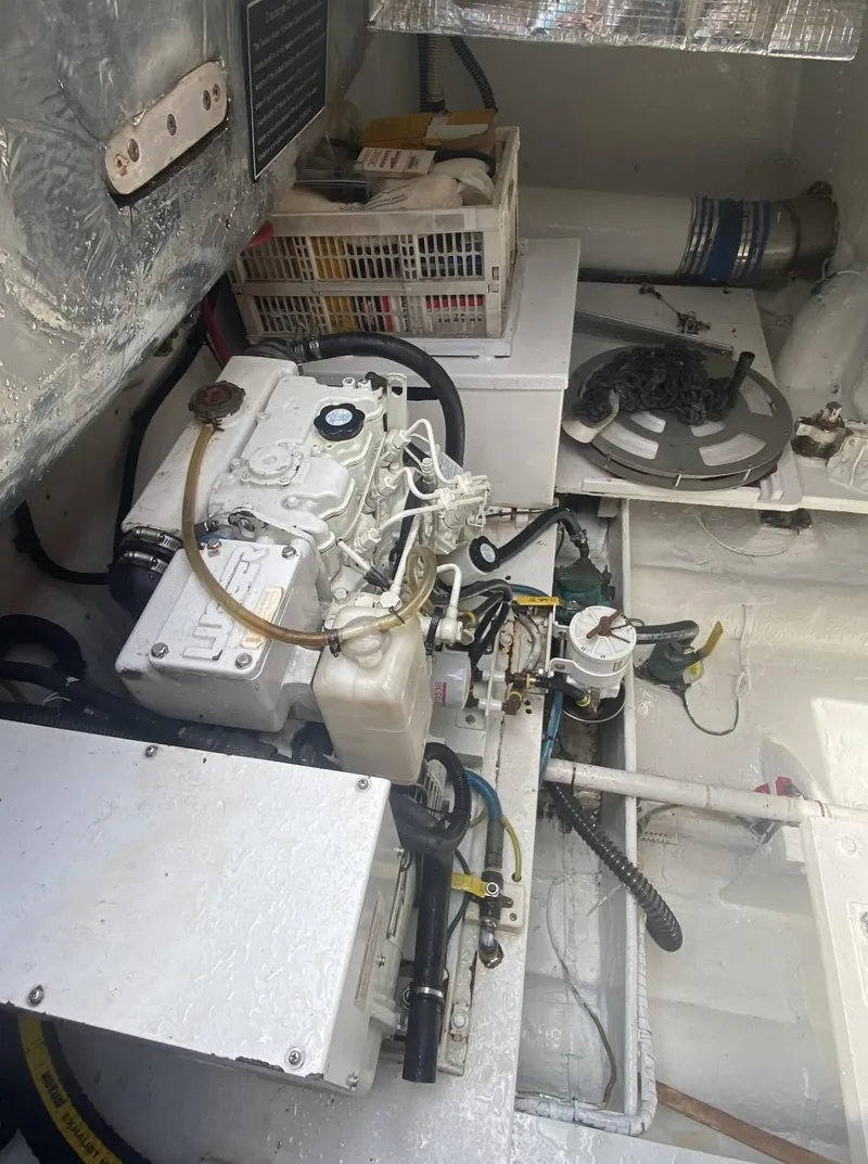 Slide: The Image of Engine room of 1986 Midnight Lace 52 Flybridge yacht, showcasing mechanical components. - 33