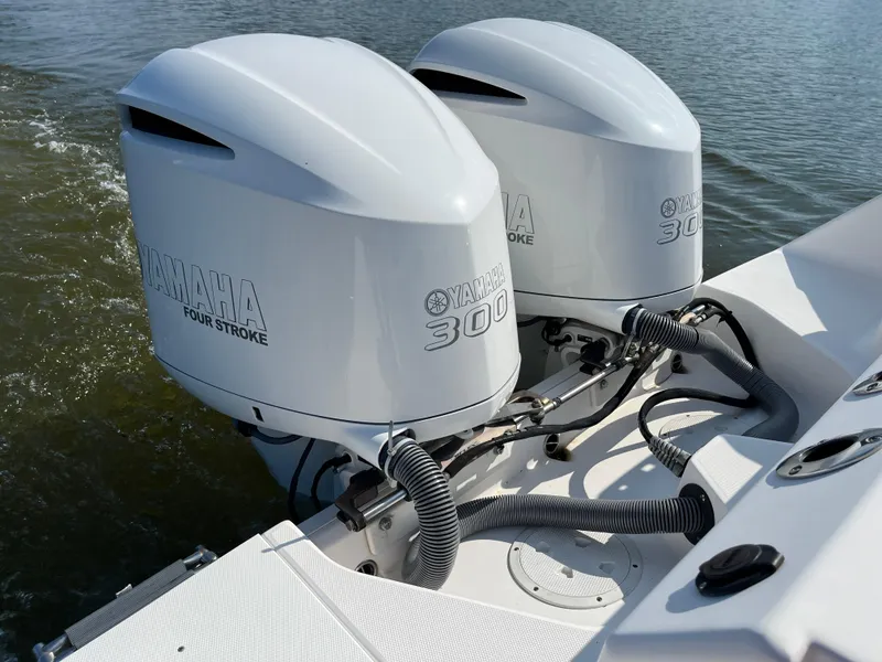 Slide: The Image of Twin Yamaha 300 engines on 2013 Everglades 295 Center Console boat. - 12