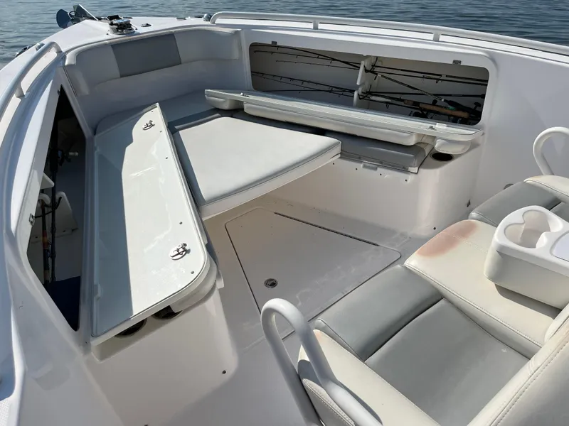 Slide: The Image of 2013 Everglades 295 Center Console boat interior with seating and storage. - 32