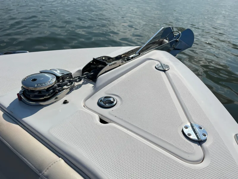 Slide: The Image of 2013 Everglades 295 Center Console boat anchor detail on calm water. - 33