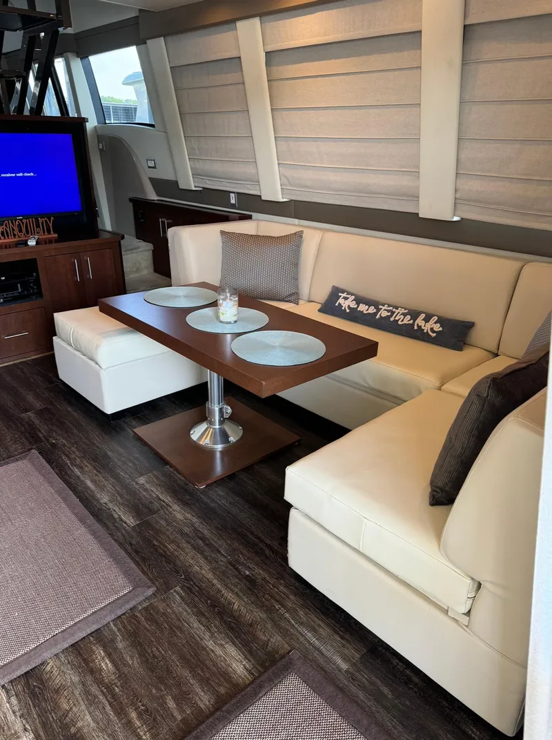 Slide: The Image of Luxurious interior of 2013 Carver 54 Voyager yacht with elegant seating and dining area. - 10