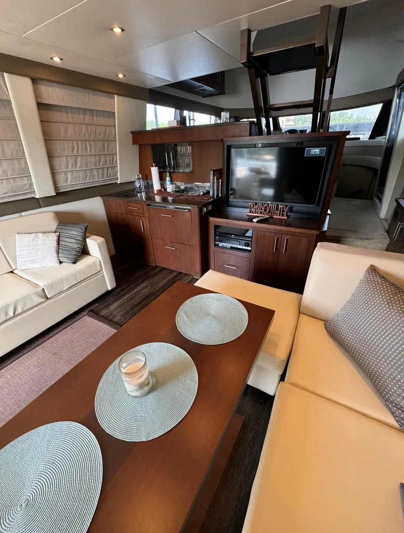 Slide: The Image of Luxurious interior of 2013 Carver 54 Voyager yacht with modern furnishings and entertainment system. - 11