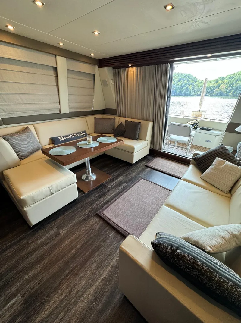 Slide: The Image of Luxurious interior of 2013 Carver 54 Voyager yacht with elegant seating and scenic view. - 12