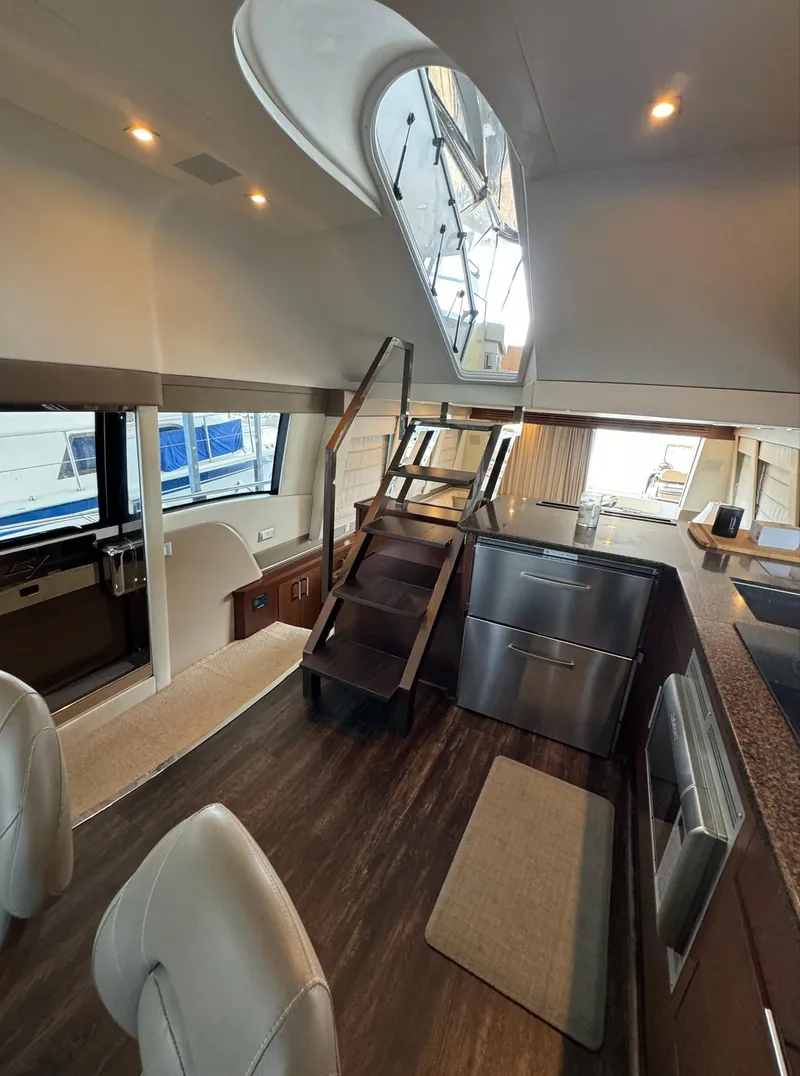 Slide: The Image of Interior of 2013 Carver 54 Voyager yacht with modern kitchen and staircase. - 18