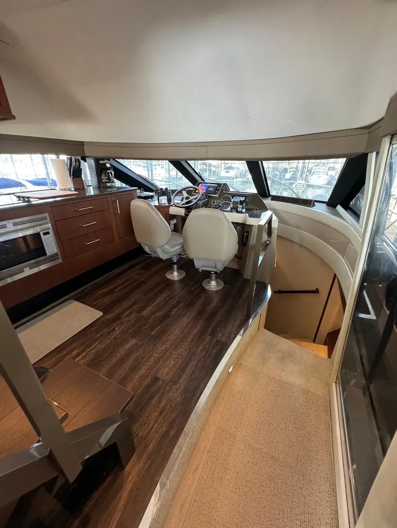 Slide: The Image of Interior of 2013 Carver 54 Voyager yacht with modern helm and seating. - 20
