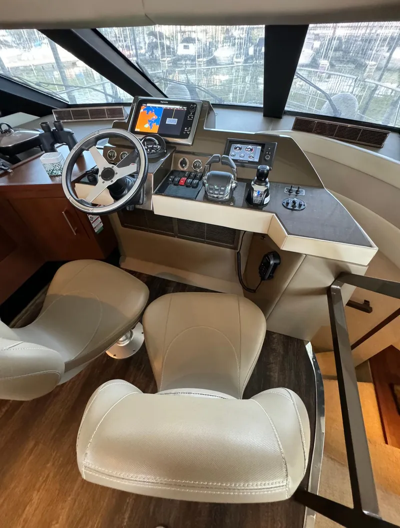 Slide: The Image of Interior helm of 2013 Carver 54 Voyager yacht with modern navigation equipment. - 21