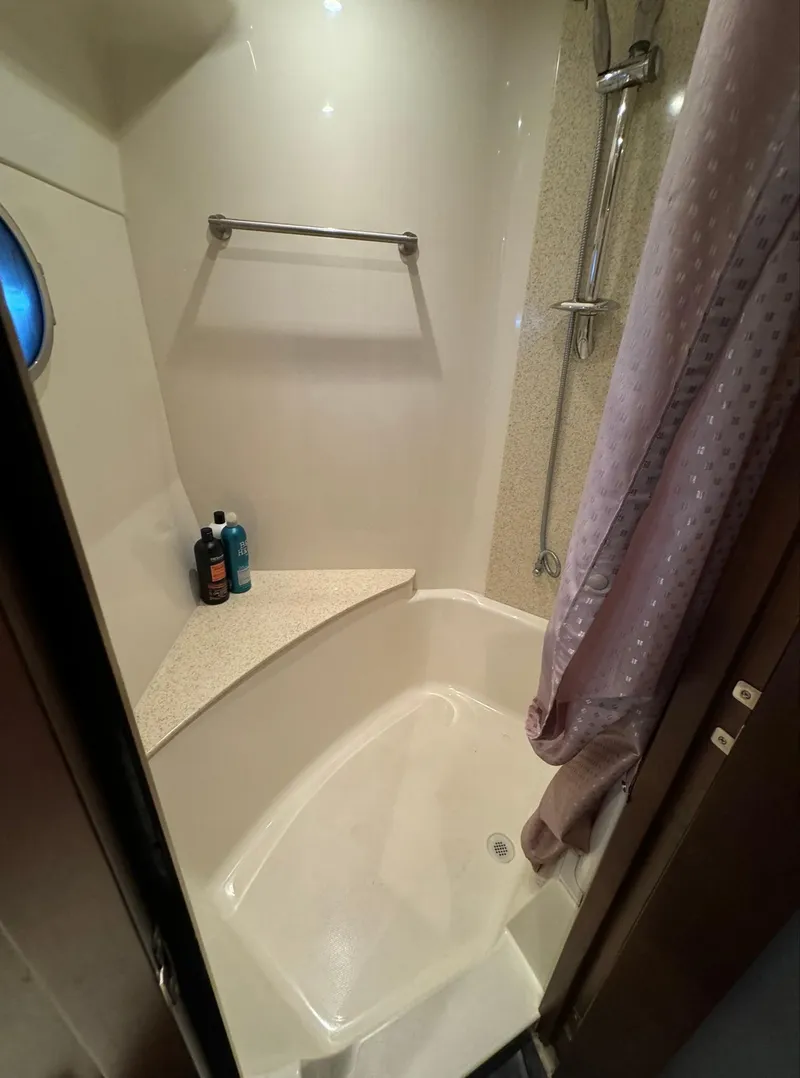 Slide: The Image of Shower area in 2013 Carver 54 Voyager yacht with toiletries and curtain. - 31