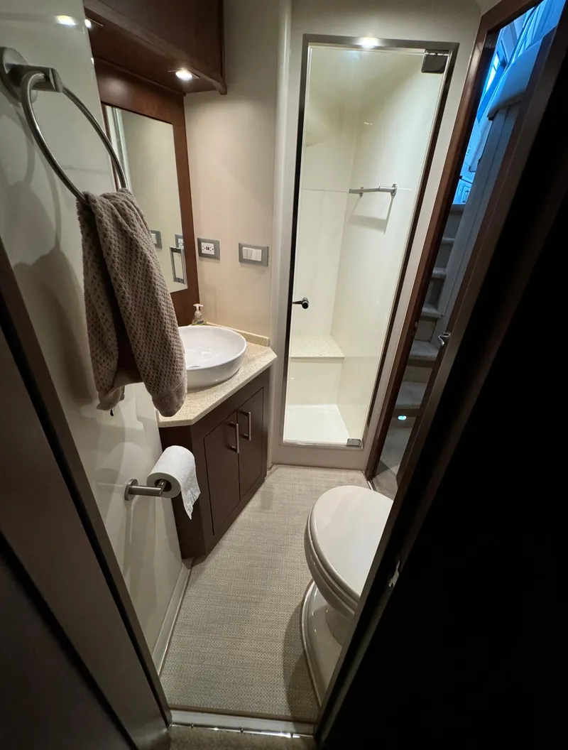 Slide: The Image of 2013 Carver 54 Voyager bathroom with modern fixtures and compact design. - 33