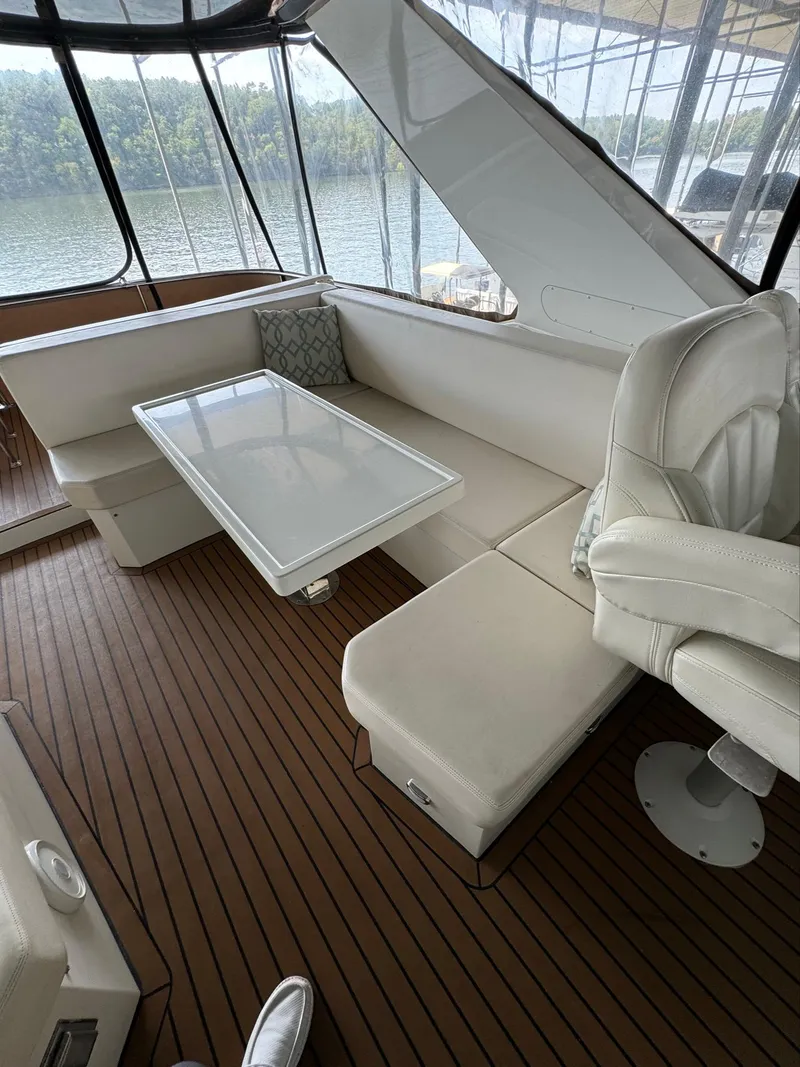 Slide: The Image of Luxurious interior of 2013 Carver 54 Voyager yacht with elegant seating and table. - 41