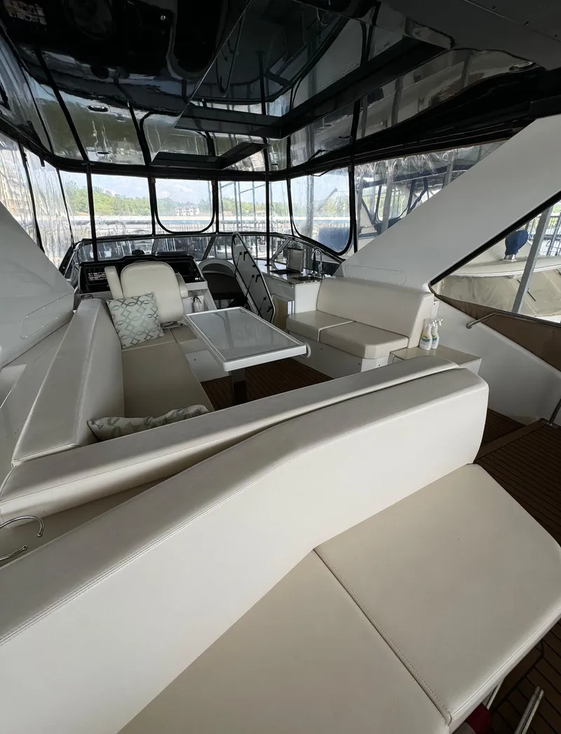 Slide: The Image of Interior of 2013 Carver 54 Voyager yacht with luxurious white seating and modern design. - 42